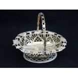A Victorian silver bon bon basket, London 1849, of pierced oval form with floral border. L. 14cm