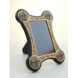 A gilded white metal and champleve enamel photograph frame with an easel back, H. 25cm.