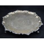 A silver salver, Adie Bros Ltd, Birmingham 1947, with shaped bead and shell rim on four acanthus