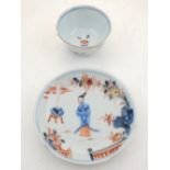 An early 18th century Chinese Kangxi / Yongzheng period blue and white tea bowl and saucer,