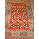 A brick red ground Turkish rug,