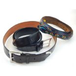 A black alligator skin ladies belt, with silver buckle and mounts, by J & M Davidson,