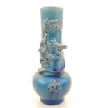 A Chinese turquoise glazed vase, with applied dragon decoration. H.22cm