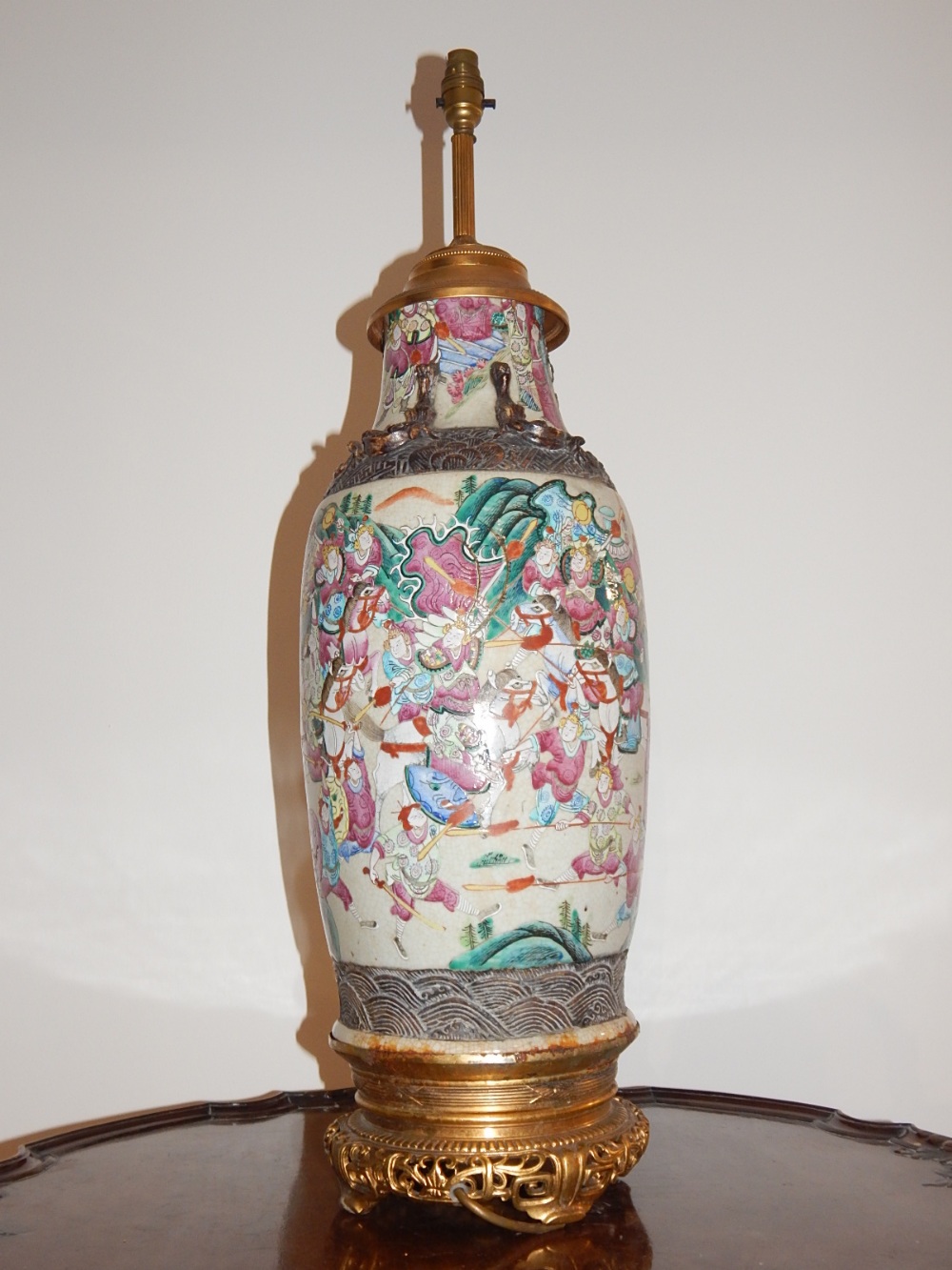 An early 20th century Chinese earthenware vase now as a lamp,