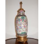 An early 20th century Chinese earthenware vase now as a lamp,