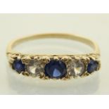 A 9ct yellow gold blue and white five stone dress ring