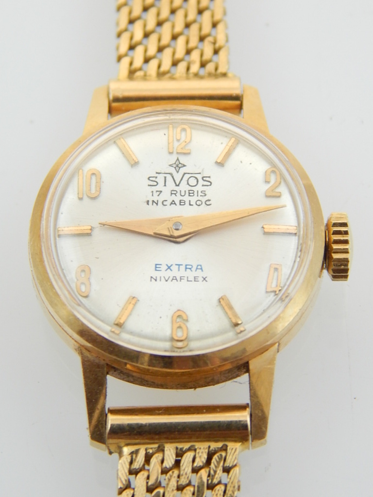 A ladies 18ct gold wristwatch on an 18ct gold mesh strap,