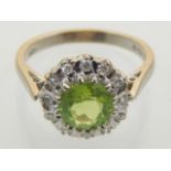 An 18ct yellow gold peridot and diamond dress ring.