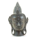 A bronze Buddhist head. H.