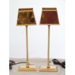 A pair of brass table lamps with rectangular brass shades, H. 58cm, (2).