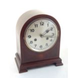 An early 20th century inlaid mahogany eight day mantel clock the circular silvered dial marked