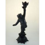 A Japanese bronze lamp base, in the form of a child holding flowers aloft, raised on a lotus base.
