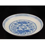 A Chinese blue and white dish, decorated with phoenixes amongst scrolling foliage, bears six