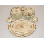 A late Victorian part dinner service decorated with pheasants and flowers on a cream ground, (qty).