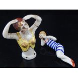 An Art Deco style ceramic pin dolly, modelled as a reclining pin up, together with another, modelled