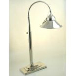 An Art Deco style nickel plated telescopic desk lamp, on stepped rectangular base. H. 54cm