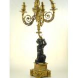 A second quarter 19th century bronze and gilt metal table light, the support in the form of a