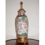 An early 20th century Chinese earthenware vase now as a lamp, decorated with a continuous band of