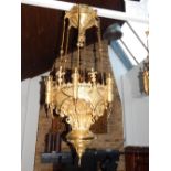 An East European, probably Russian, gilt bronze six light chandelier, with coronet surmounts flanked
