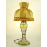 A French frosted glass baluster table lamp circa 1940, decorated with green gilt and grey panel