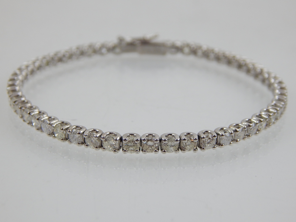 A 18ct white gold diamond tennis bracelet, diamonds of 4.37ct combined. - Image 3 of 3