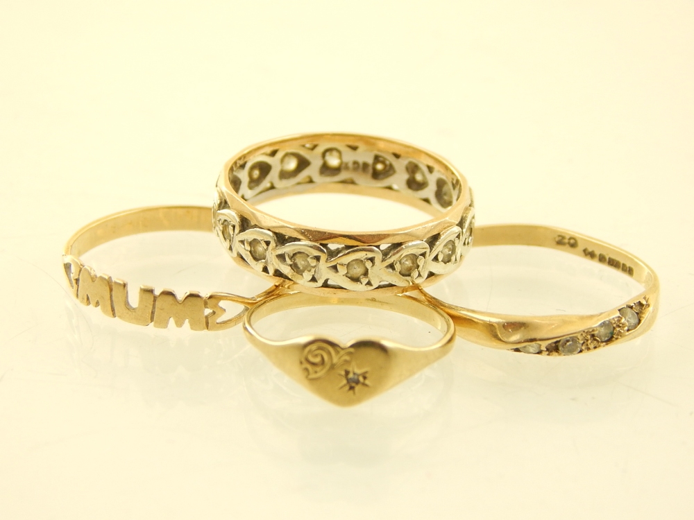 Four 9ct yellow gold rings, to include a four white stone, an eternity, a mum and a heart ring.