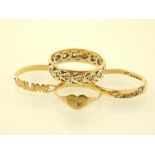 Four 9ct yellow gold rings, to include a four white stone, an eternity, a mum and a heart ring.