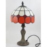 A small Tiffany style table lamp, together with a 1950s glass ceiling shade,