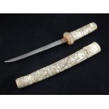 A 20th century Japanese wakizashi, the bone handle and scabbard carved with numerous Samuri,