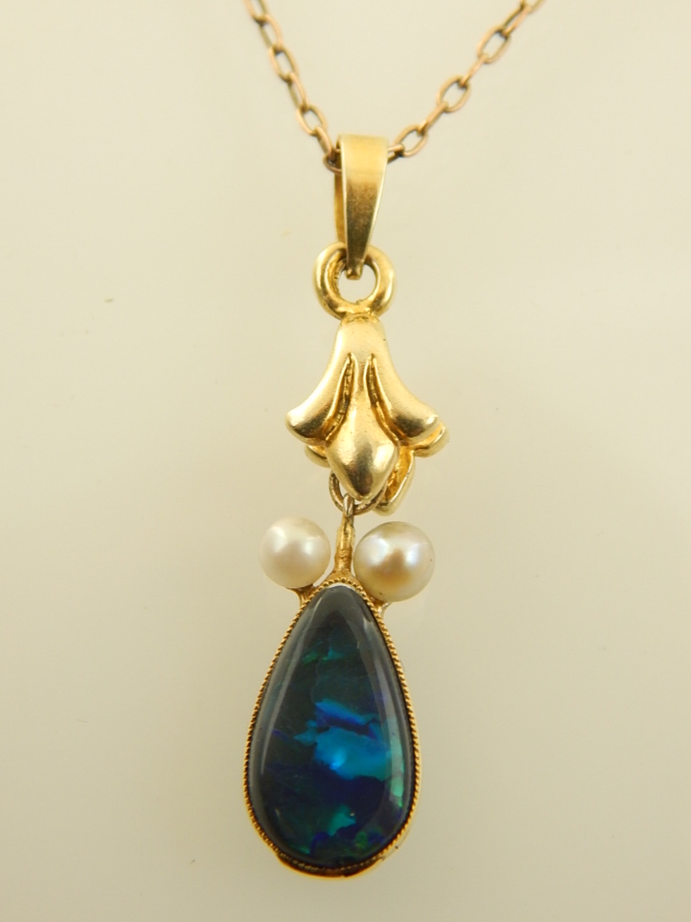 A yellow metal opal and pearl set drop pendant, suspended on a 9ct yellow gold chain. - Image 2 of 3