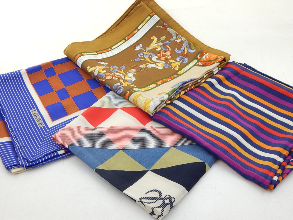 Four Loewe polychrome decorated silk scarves.