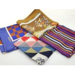 Four Loewe polychrome decorated silk scarves.