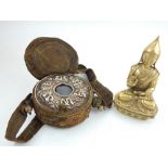 A Tibetan brass figure of Buddha seated on a lotus base, H.