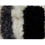 Three marabou ostrich feather scarfs in white, grey and black.