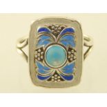 An Art Nouveau style white metal and enamelled dress ring.