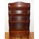 A George III design mahogany graduated open bookcase, fitted drawer on ogee bracket feet. H.