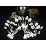 Four 18th / 19th century silver table spoons, together with a later silver grapefruit spoon,