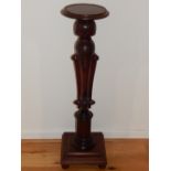 A Victorian carved mahogany torchere,