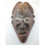 A mid 20th century Tikar West African mask, the eyelashes,