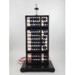 A vintage lacquered wood abacus,