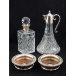 A modern silver mounted spirit decanter, together with a plate mounted claret jug,