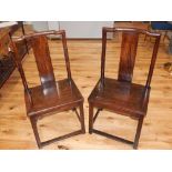 A pair of late 19th century Chinese hardwood chairs, with shaped solid splats,