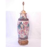 An early 20th century Chinese earthenware vase now as a lamp,