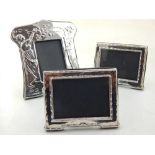An Art Nouveau style silver easel picture frame, stamped 925, together with a pair of silver easel