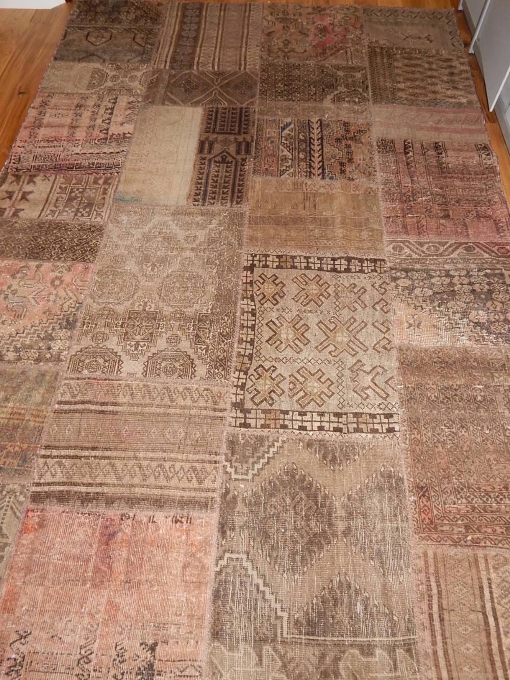 A patchwork rug of geometric design.