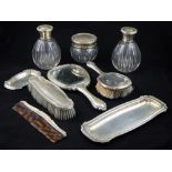 A mid 20th century Spanish silver mounted nine piece dressing table set,