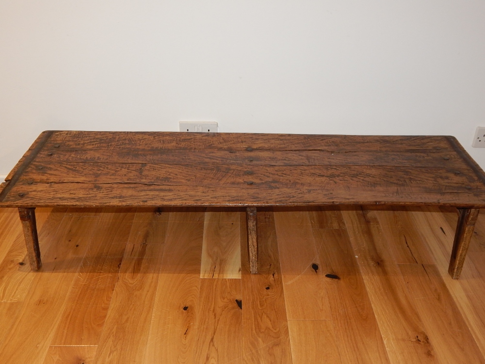 A provincial iron bound low occasional table, with planked top on splayed feet, - Image 2 of 3