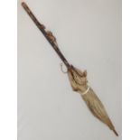 An early 20th Japanese parasol, carved with rat to handle.