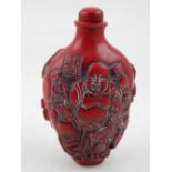 A Chinese snuff bottle, decorated with the eight immortals, inscription to tablets. H.