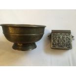 A Middle Eastern twin-handled brass box with hinged lid, engraved with scrolling foliage,
